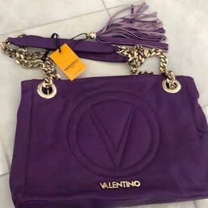 Purple leather handbag